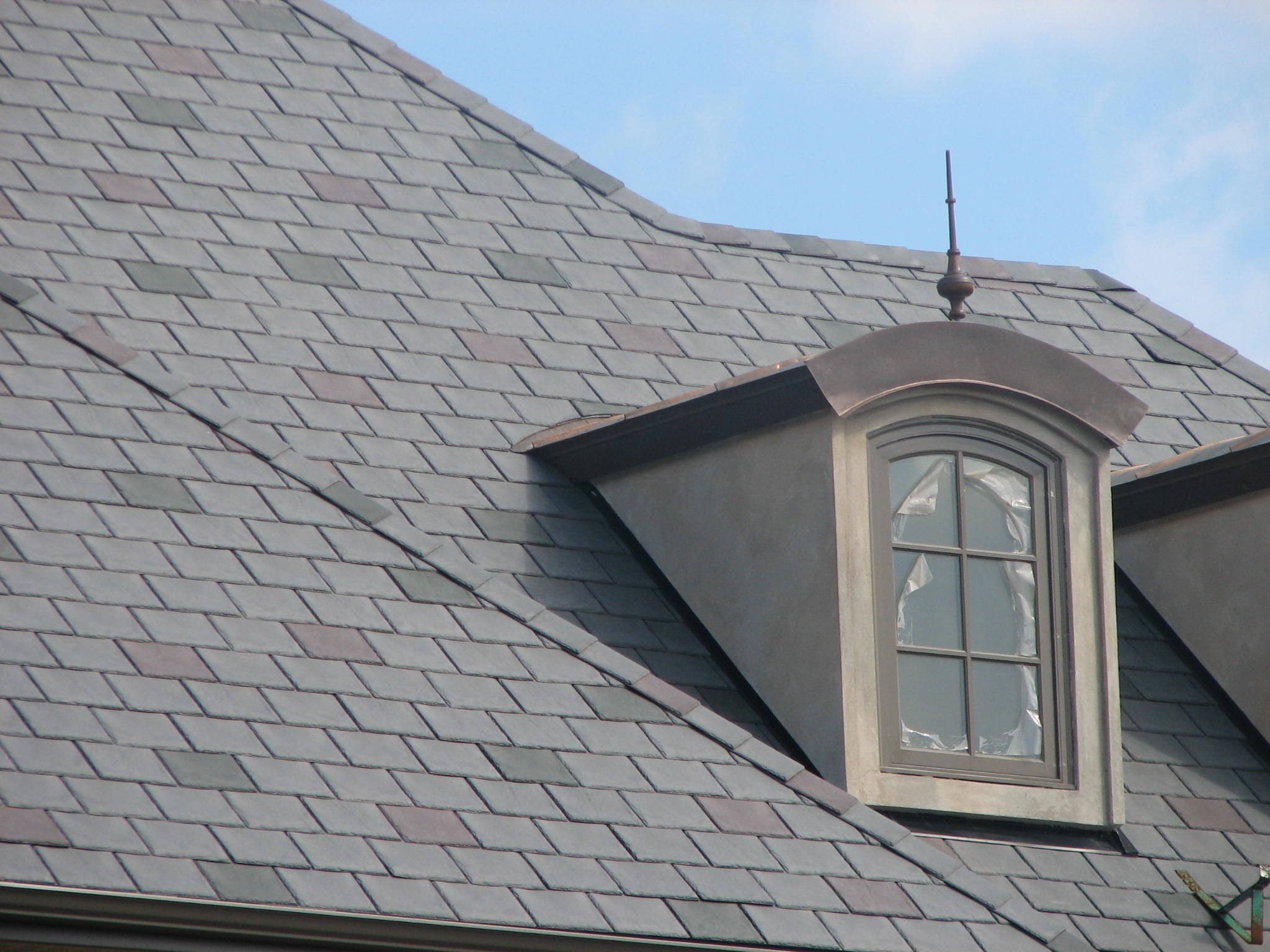 Inspire with copper dormer and finial DeLuca Roofing Inc.
